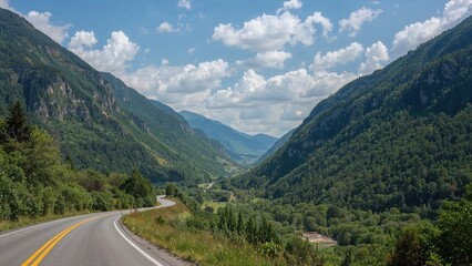 Naklejka premium Breathtaking views of rugged hillsides covered in rich foliage by a countryside route in a valley