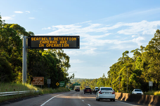 seatbelt detection cameras are in operation displayed on digital sign above highway in NSW Australia