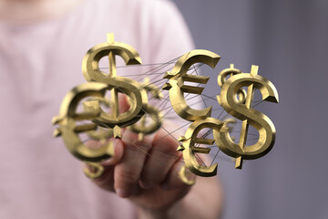Image depicts interconnected dollar and euro signs, symbolizing global finance and currency exchange.