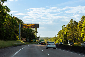 wear a seatbelt correctly penalties apply on digital highway sign during seatbelt safety campaign