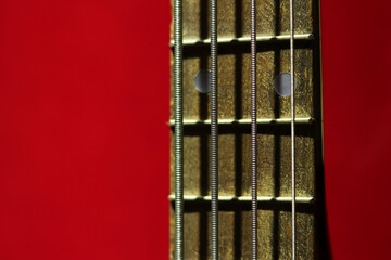 Guitar strings close-up. Guitar fretboard. Musical instrument. Hobby. Close-up of guitar neck with...