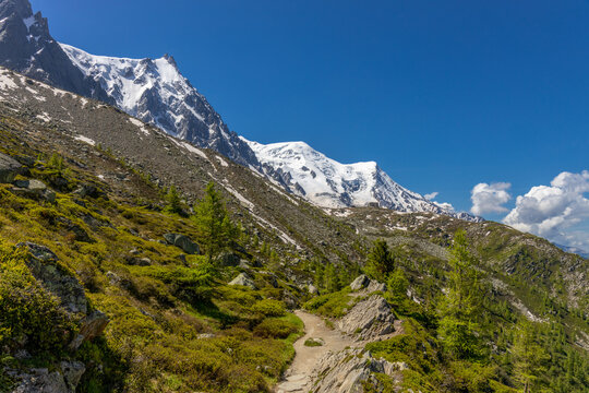 Chamonix valley landscape of a prominent rocky towering mountain peak Aiguille du Midi in French Alps. Chamonix-Montblanc area, Tour du Montblanc beautiful landscape Aiguille du Midi summit, France