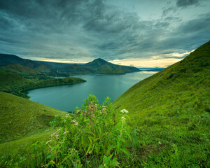 Lake Toba's breathtaking beauty is a sight to behold, with its vast waters and picturesque surroundings creating a tranquil and unforgettable experience