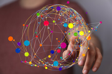 Abstract image of a hand interacting with a colorful global network.  Perfect for technology,...