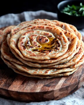 Macro view of paratha layers ghee glistening on flaky surface