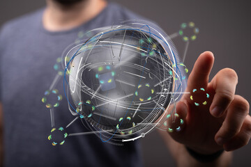 A man interacts with a holographic globe, showcasing global connectivity and data visualization.