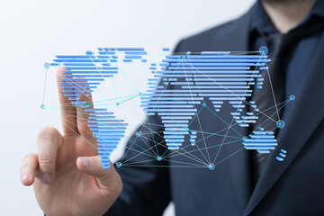 Man interacts with a digital world map, illustrating global connectivity and networking.
