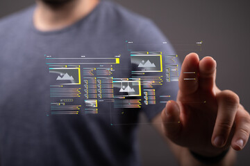 Person using futuristic interface to manage images.  Digital photo management concept.