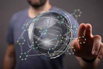 Stock photo of a person interacting with a digital globe, representing global network, technology,...