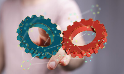Image of two gears meshing, symbolizing teamwork, collaboration, and synergy in business.