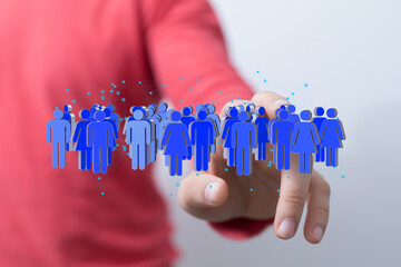 Image depicting a hand interacting with a network of diverse people, symbolizing global connection...