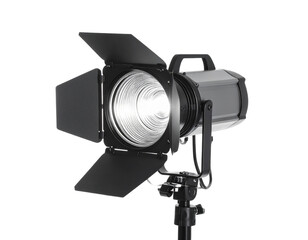 A large, professional studio spotlight on a stand, isolated on a white background.