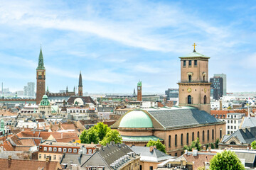 Obraz premium Sweeping views of Copenhagen's historic rooftops and Church of Our Lady
