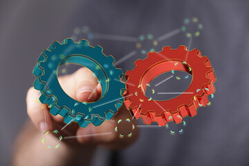 Image of two gears working together, symbolizing teamwork, collaboration, and success.