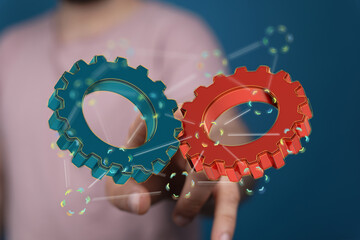 Image of two gears meshing, symbolizing teamwork, collaboration, and efficient workflow.