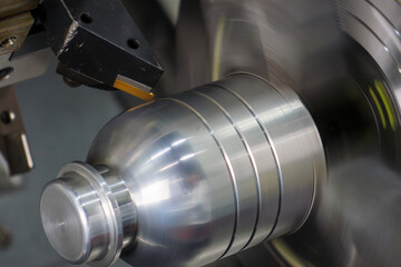 Close up scene the CNC lathe machine groove cutting the mold parts.