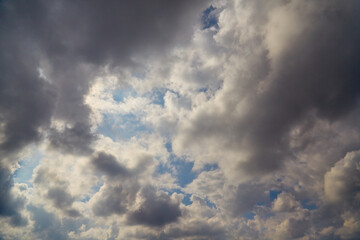 Intermittent gaps between clouds create a dynamic sky — a visual metaphor for hope and light in dark times. Often used in motivational content.