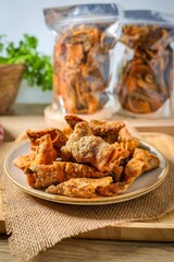 crispy salmon skin,fried salmon skin in ceramic plate 