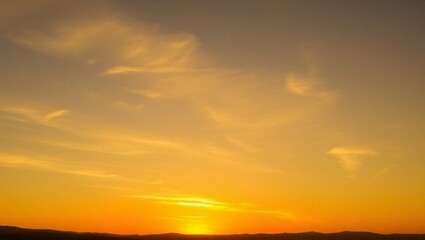 Fototapeta premium Beautiful Golden Sunset Over a Grassy Horizon