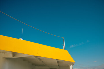 Part of ship roof against blue sky