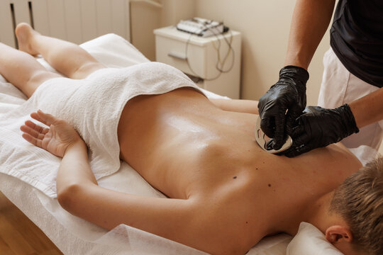 Therapist Performing IASTM Metal Scraper Massage for Myofascial Release and Sports Injury Recovery - Powered by Adobe