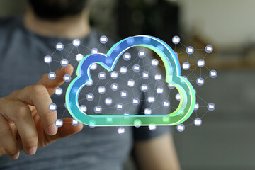 Man interacts with a digital cloud, showcasing secure file storage and data access.