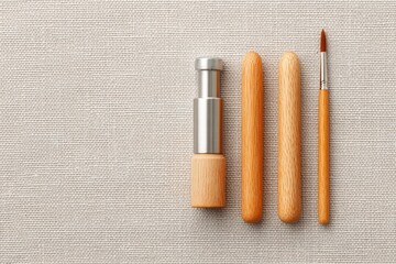 flat-lay of drum key tuning gauge and brush sticks on neutral canvas