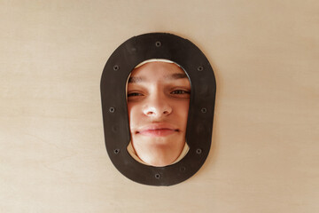 Portrait of a Smiling Client in Massage Table Face Hole at Rehabilitation or Wellness Therapy Session
