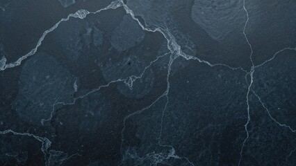 Texture of dark blue slate stone as an abstract backdrop