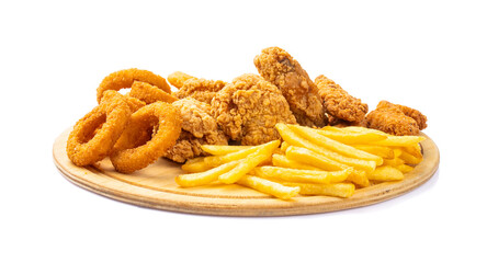 Chicken fillets, wings, onion rings and fries on white background