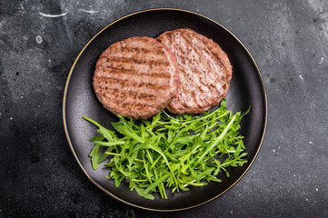 Grilled beef and pork meat patty paired with fresh veggies, an essential component for gourmet...