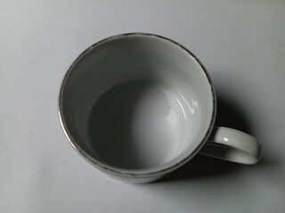 empty cup closeup on white background.