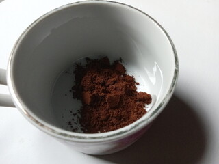 ground coffee in a mug.