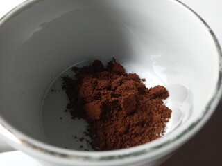 ground coffee in a mug.