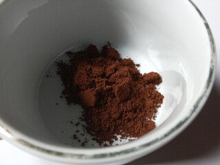 ground coffee in a mug.