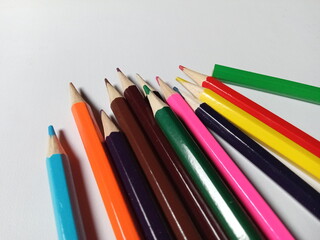 Fototapeta premium Colored pencils on a white background. Back to school, art drawing.