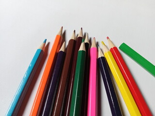 Colored pencils on a white background. Back to school, art drawing.