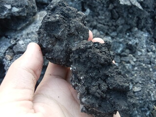 an illustration holding coal. mining theme	