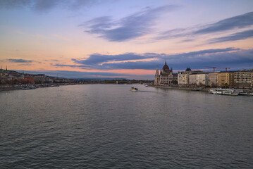 Fototapeta premium View from Budapest over the Danube with the Parliament House at sunset