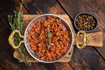Bolognese Sauce, Authentic Italian meat and tomato pasta recipe. wooden background. top view