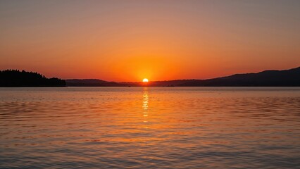 Obraz premium Magnificent sunset casting colors on the water
