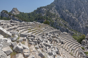 The amphitheater was built in the II century BC according to the classical Roman principle. Amphitheater in the ancient city of Termessos in Turkey. The amphitheater is high in the mountains.