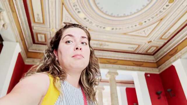 Woman Vlogging Inside Zappeion Hall with Columns Background