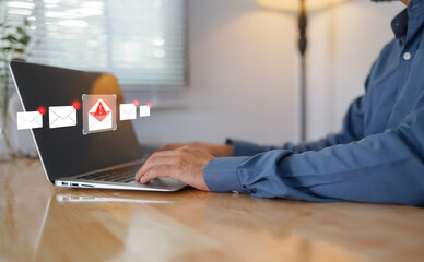 Phishing email alert concept with a person using a smartphone while surrounded by warning icons, symbolizing scam messages, cyber threats, and digital communication security risks.