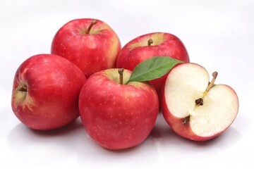 An apple is a round, edible fruit produced by an apple tree. Apple isolated