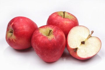 An apple is a round, edible fruit produced by an apple tree. Apple isolated