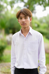 Non binary university student in college campus