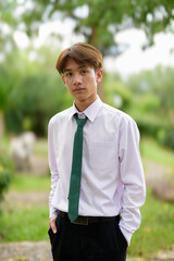Non binary university student in college campus