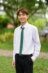 Non binary university student in college campus