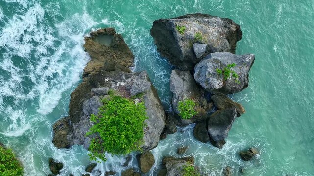 Top Aerial View of Tropical Beach in Bali, Indonesia. Empty paradise beach, blue sea waves in Bali island, Indonesia